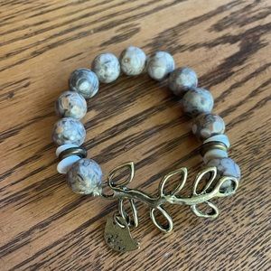 Genuine stone bracelet with gold details.